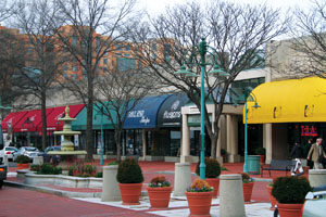 Concentrated redevelopment has spawned new commercial districts along the Rosslyn-Ballston Corridor (top), and in Shirlington Village and Pentagon Row. Courtesy of Arlington Economic Development