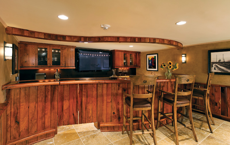 The McClures considered excavating to raise the ceilings, but decided they liked the coziness of the existing ceiling height. Photo by Greg Hadley