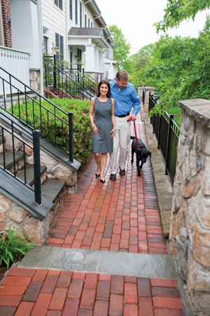 Sheri Nassikas and Steve Hancock with their black Lab, Lucy. Photo by Michael Ventura