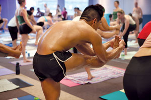 Bikram, or “hot” yoga is practiced in a heated studio to loosen the muscles and detox the body.  Photo by Huguette Roe