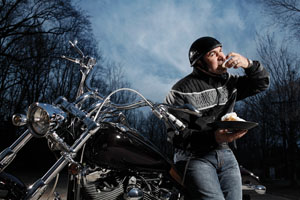 Bayou Bakery creator David Guas loves motorcycles and his own beignets. Other chefs are fans of his New Orleans-style sweets, too. Photo by Jonathan Timmes